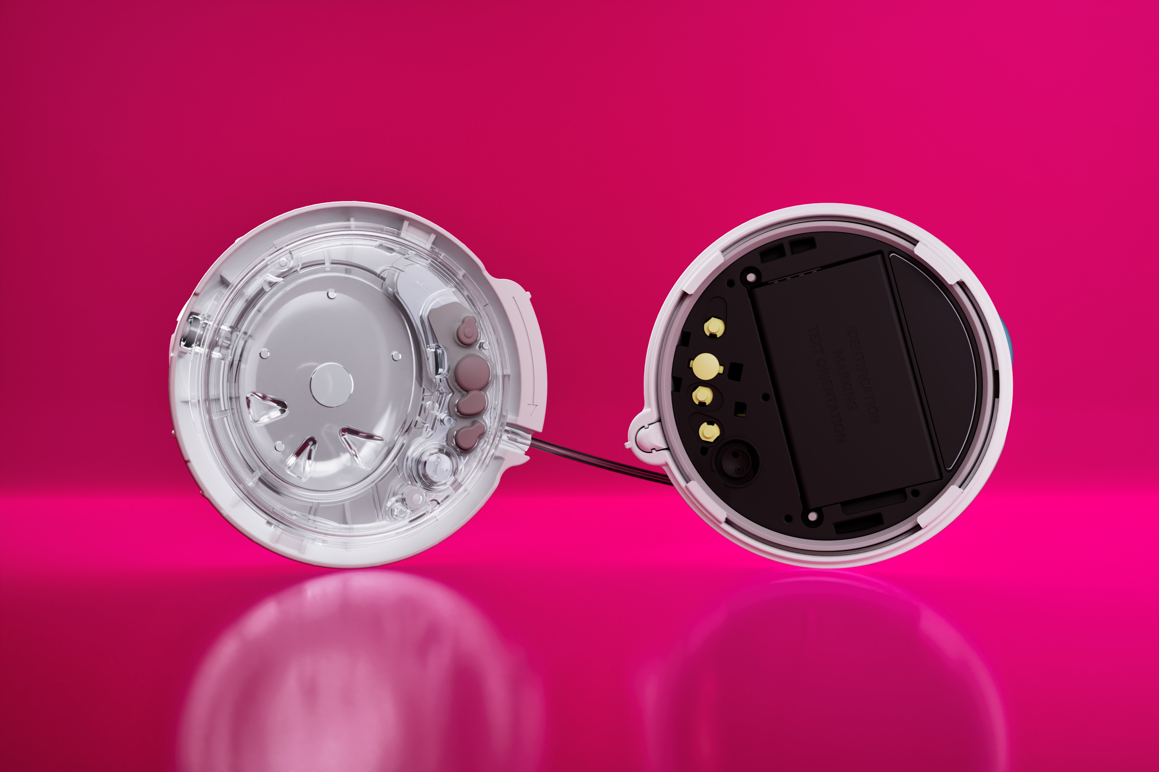 Front and back of the twiist device on a pink background